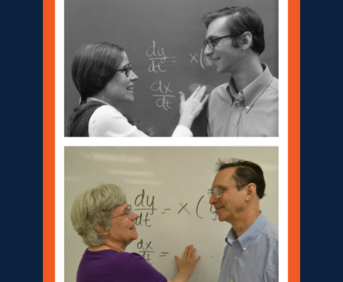 Kay and Steve Robbins smiling by whiteboard